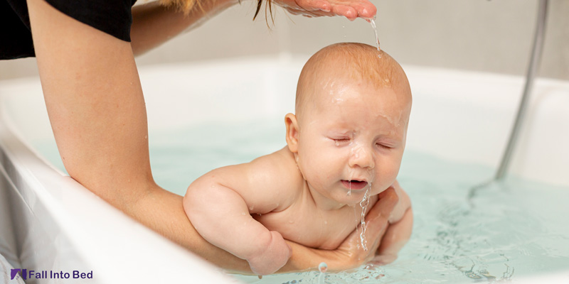 baby taking warm bath to fall asleep quickly