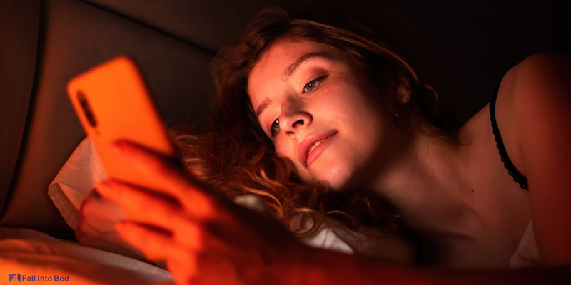 girl using phone before bed 