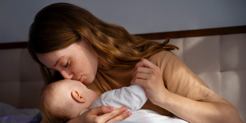 mother signing lullaby to baby to put him to sleep