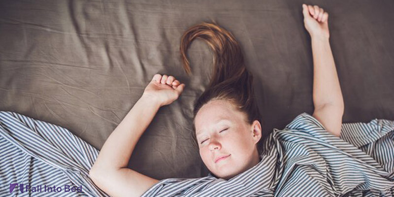 girl sleeping with hands above her head