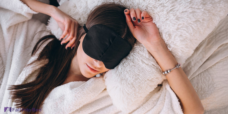 woman sleeping with hands above her head