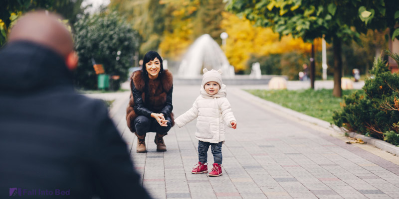 baby practicing walking to avoid sleep regression