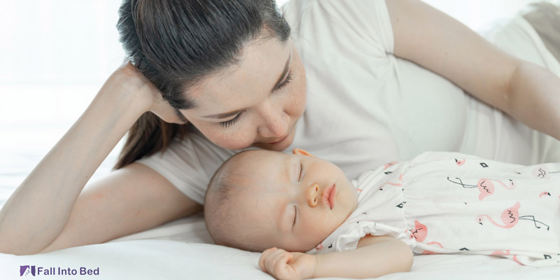 mother sleeping with baby