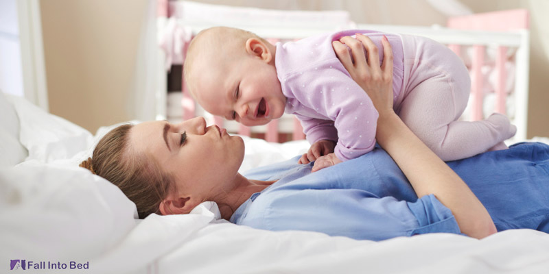 mother playing with baby